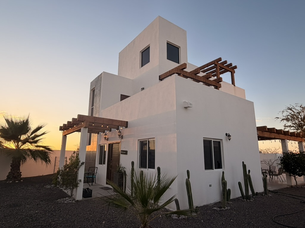 Casa Claudia — southeast elevation at dusk